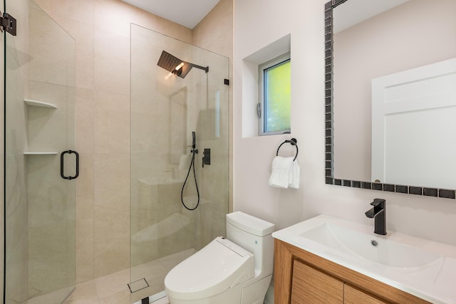 bathroom featuring toilet, a shower stall, and vanity