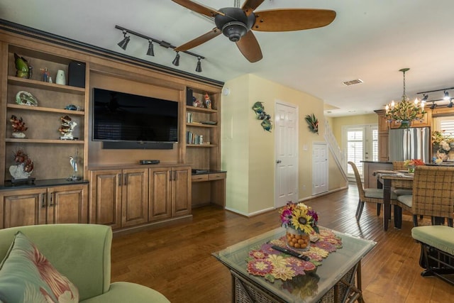 212 Southard St, Key West, FL 33040 - living area with ceiling fan, rail lighting, dark wood finished floors, and a chandelier