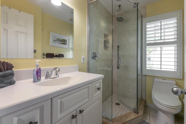 212 Southard St, Key West, FL 33040 - bathroom featuring vanity, toilet, a shower stall, and tile patterned floors
