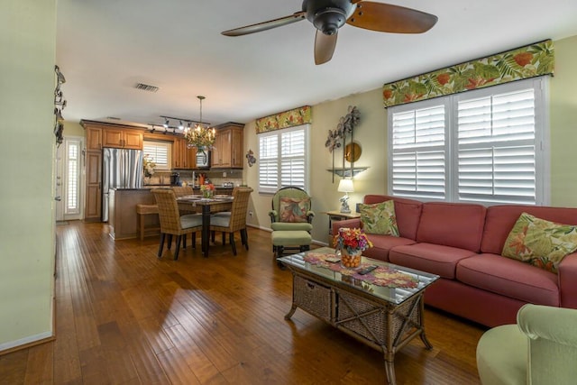 212 Southard St, Key West, FL 33040 - living area with ceiling fan, a chandelier, wood-type flooring, and baseboards