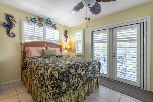 212 Southard St, Key West, FL 33040 - tiled bedroom featuring access to outside, multiple windows, a ceiling fan, and baseboards