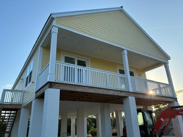 back of house with a balcony