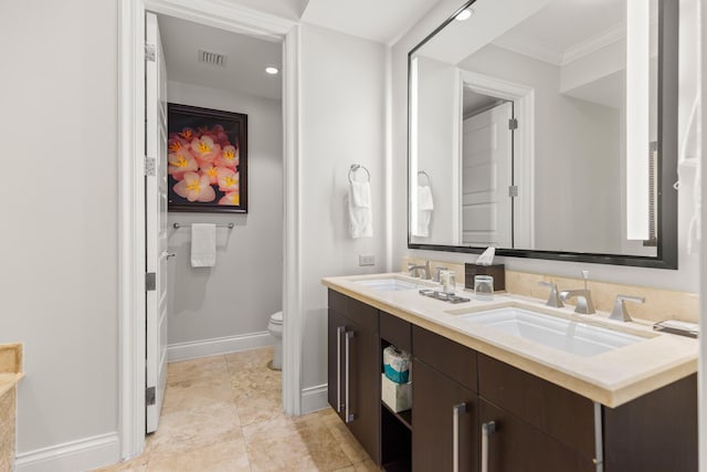 3841 N Roosevelt Blvd Unit 222, Key West, FL 33040 - bathroom featuring crown molding, vanity, and toilet