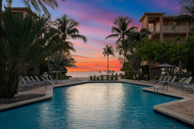3841 N Roosevelt Blvd Unit 222, Key West, FL 33040 - pool at dusk featuring a water view and a patio area