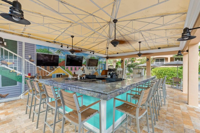 3841 N Roosevelt Blvd Unit 222, Key West, FL 33040 - view of patio featuring ceiling fan and an outdoor bar