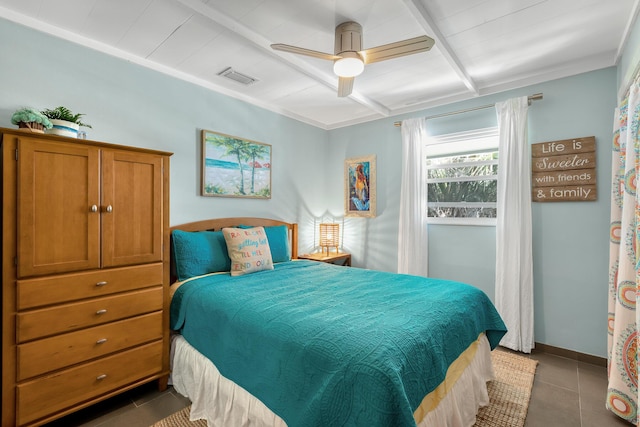 tiled bedroom featuring ceiling fan