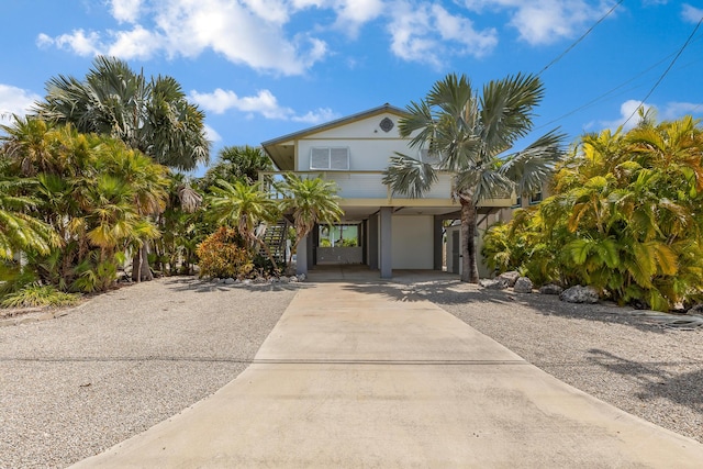 coastal inspired home featuring a carport