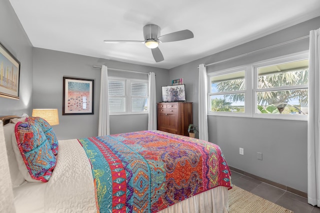 tiled bedroom with ceiling fan