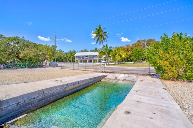 view of pool with fence