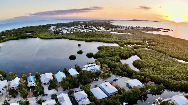 aerial view at dusk with a water view