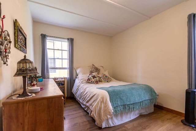 bedroom with hardwood / wood-style floors