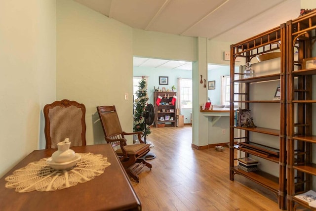 living area with hardwood / wood-style floors