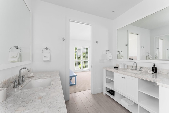 bathroom featuring wood-type flooring and vanity