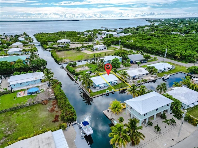 bird's eye view with a water view and a residential view