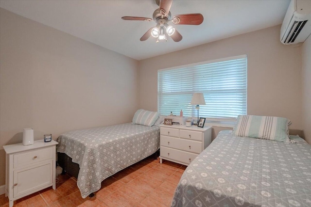 bedroom with light tile patterned floors, a ceiling fan, and a wall mounted AC