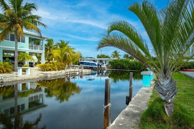 property view of water featuring a boat dock