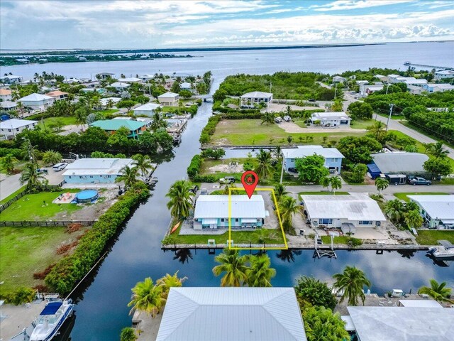 bird's eye view with a residential view and a water view