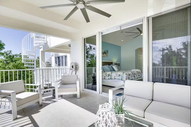 exterior space featuring outdoor lounge area and ceiling fan