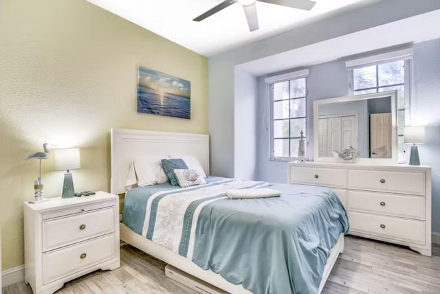 bedroom featuring ceiling fan and light hardwood / wood-style flooring