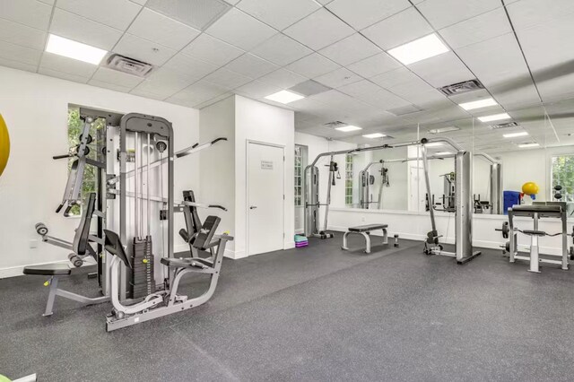 exercise room with a drop ceiling