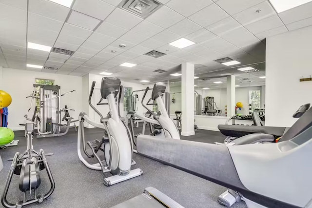 workout area featuring a paneled ceiling