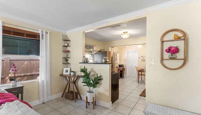 interior space featuring crown molding and light tile patterned flooring