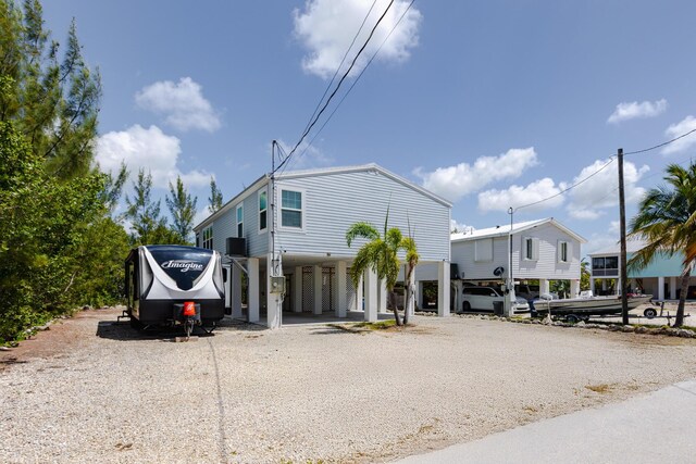 27163 Mariposa Rd, Ramrod, FL 33042 - view of front of property with dirt driveway and a carport