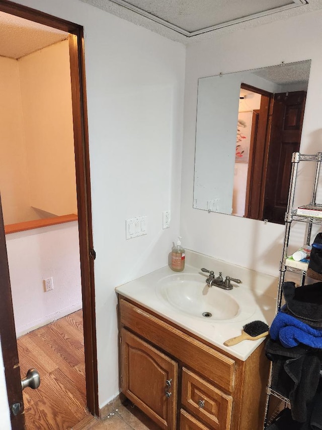 bathroom featuring vanity and wood finished floors