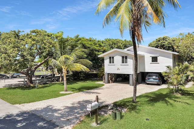 exterior space featuring a lawn and a carport