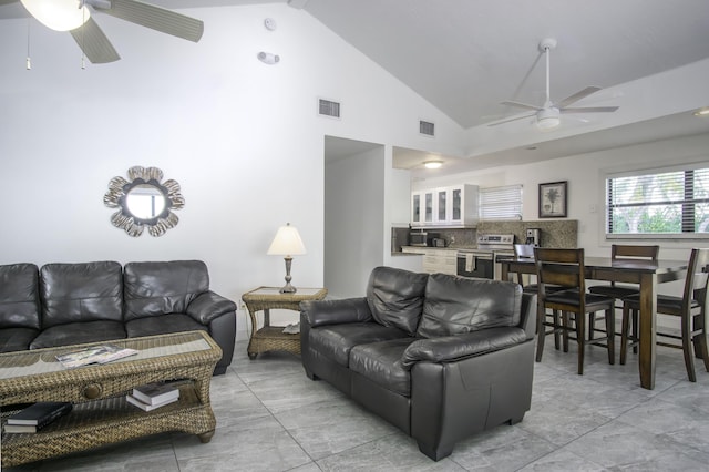 living room featuring high vaulted ceiling and ceiling fan