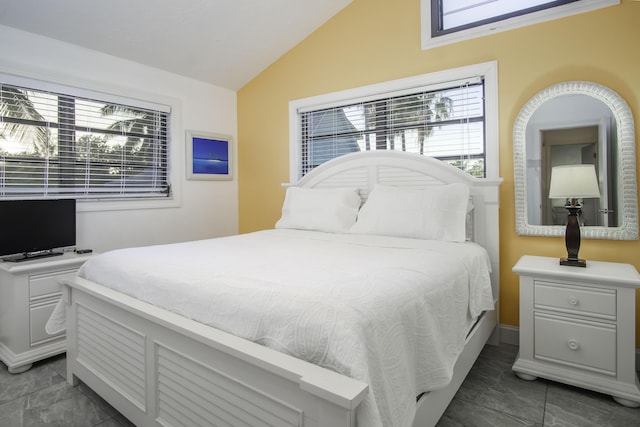 bedroom with lofted ceiling