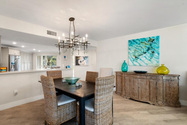 dining space with light hardwood / wood-style flooring