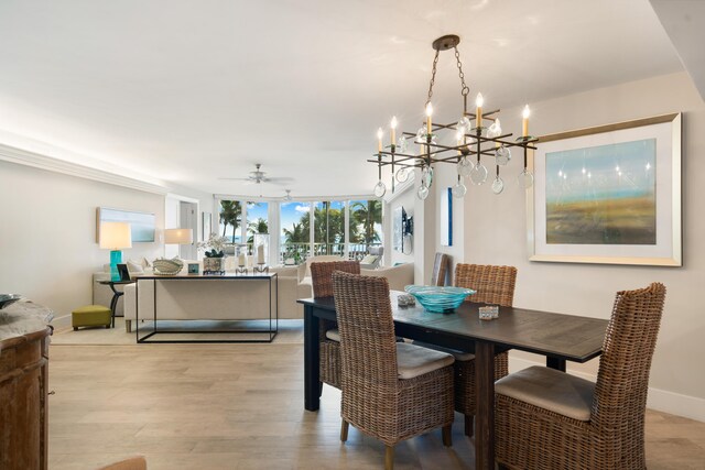 dining area with light hardwood / wood-style flooring and ceiling fan