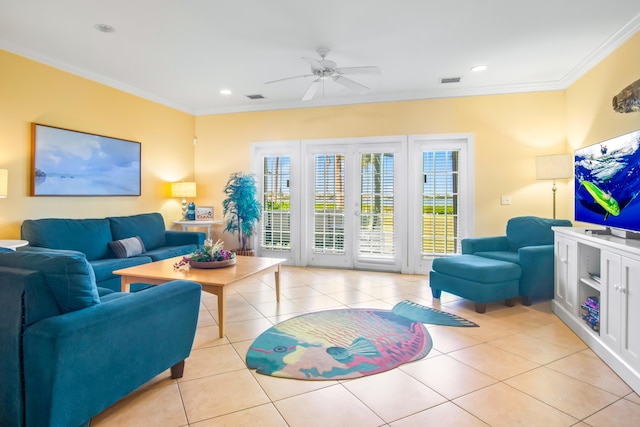 living area with light tile patterned flooring, crown molding, ceiling fan, and visible vents