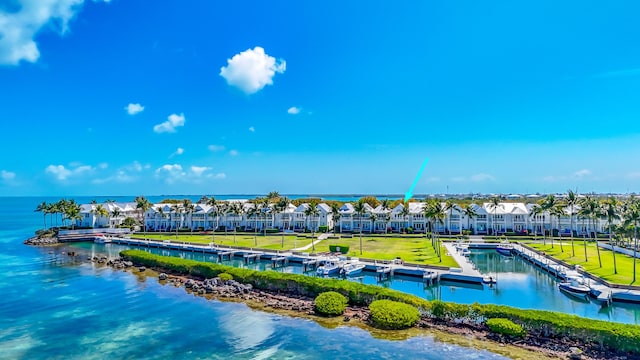 birds eye view of property with a water view and a residential view