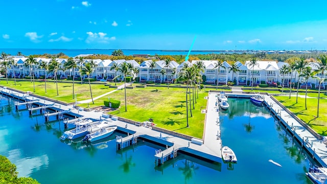 bird's eye view featuring a water view and a residential view