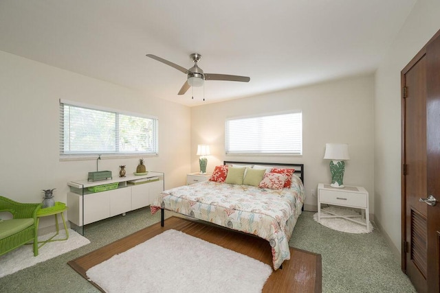 bedroom featuring multiple windows and ceiling fan