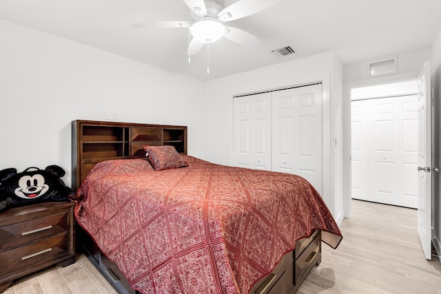 bedroom featuring a closet, ceiling fan, and light hardwood / wood-style flooring