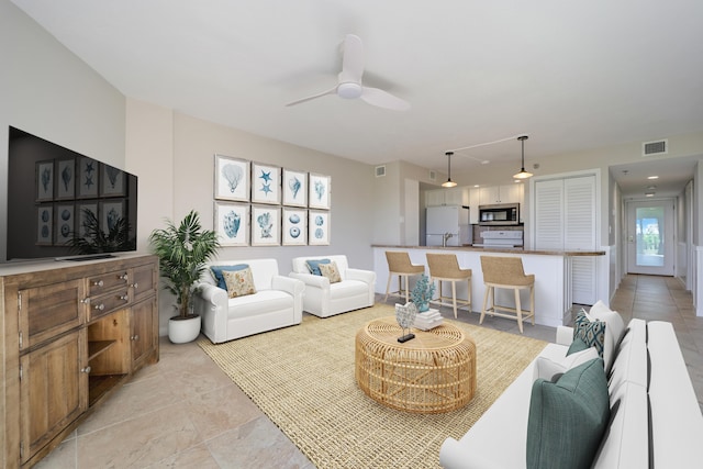 living room featuring ceiling fan