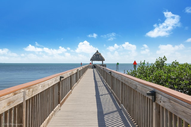 dock area with a gazebo and a water view