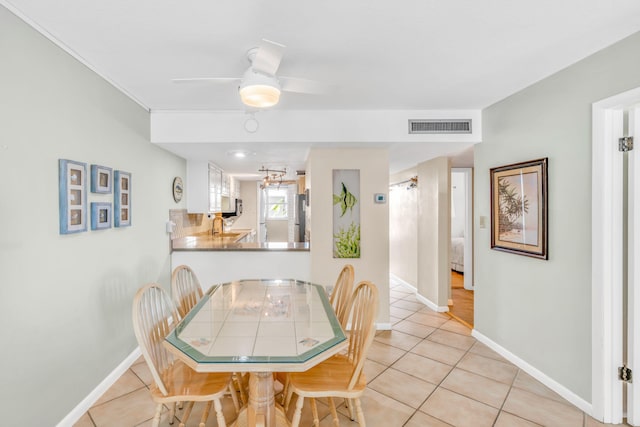 201 E Ocean Dr Unit 110, Key Colony, FL 33051 - dining space featuring light tile patterned flooring and a ceiling fan