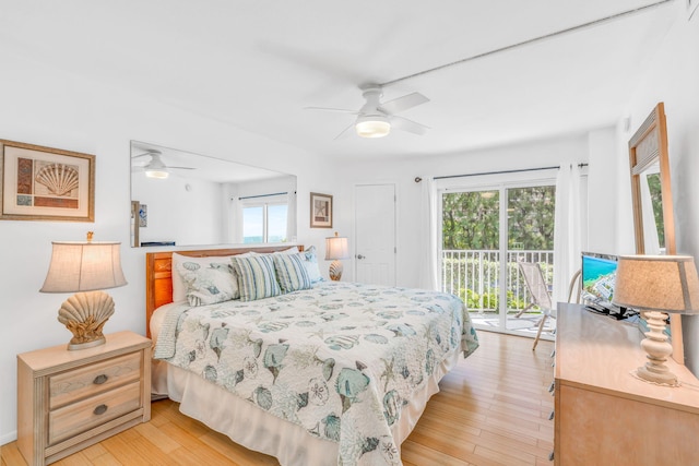 201 E Ocean Dr Unit 110, Key Colony, FL 33051 - bedroom with access to outside, light wood-type flooring, and ceiling fan