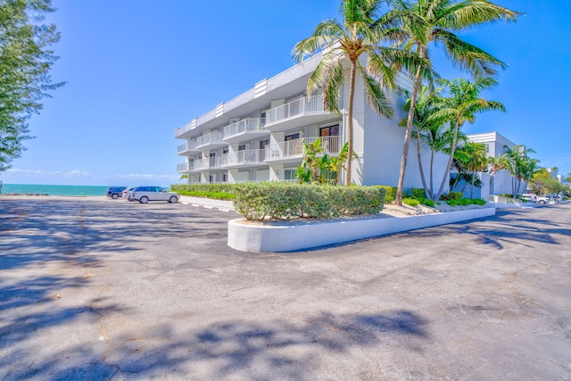 201 E Ocean Dr Unit 110, Key Colony, FL 33051 - view of property with a water view and uncovered parking