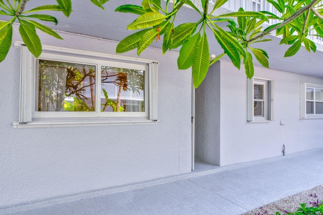 201 E Ocean Dr Unit 110, Key Colony, FL 33051 - view of home's exterior featuring stucco siding