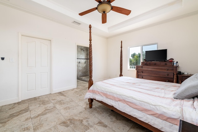 bedroom featuring ensuite bath, ornamental molding, a raised ceiling, and ceiling fan