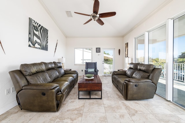 tiled living room with crown molding and ceiling fan