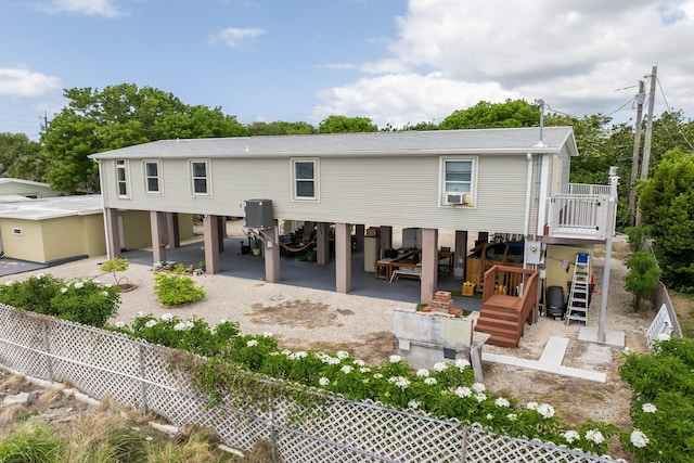 7 125th St, Gulf, Marathon, FL 33050 - back of house featuring a carport and stairway