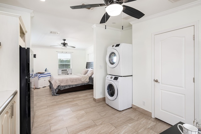 7 125th St, Gulf, Marathon, FL 33050 - bedroom with estacked washer and dryer, crown molding, freestanding refrigerator, ceiling fan, and baseboards