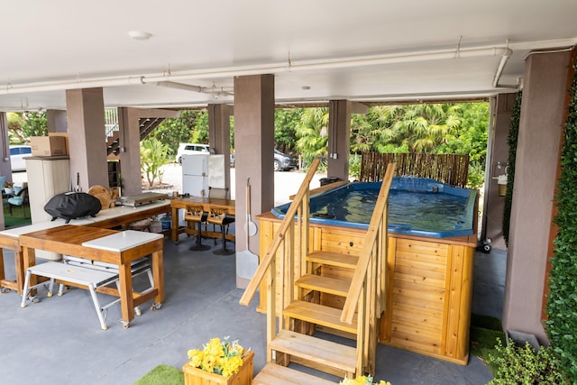 7 125th St, Gulf, Marathon, FL 33050 - wooden deck featuring a hot tub, outdoor dining space, and a patio