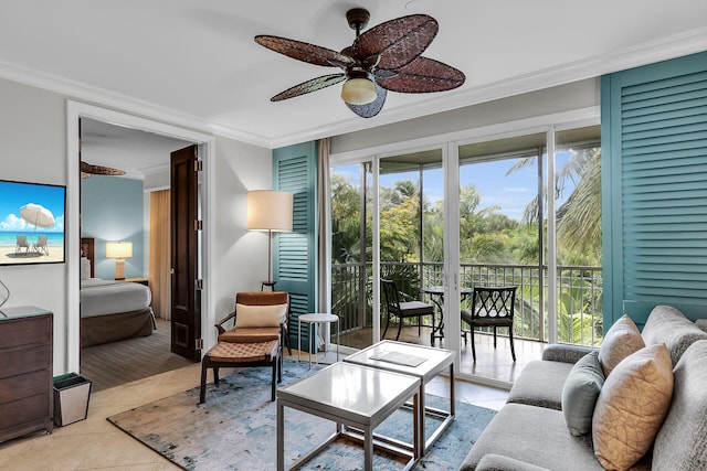 living room with light tile patterned flooring, crown molding, and ceiling fan